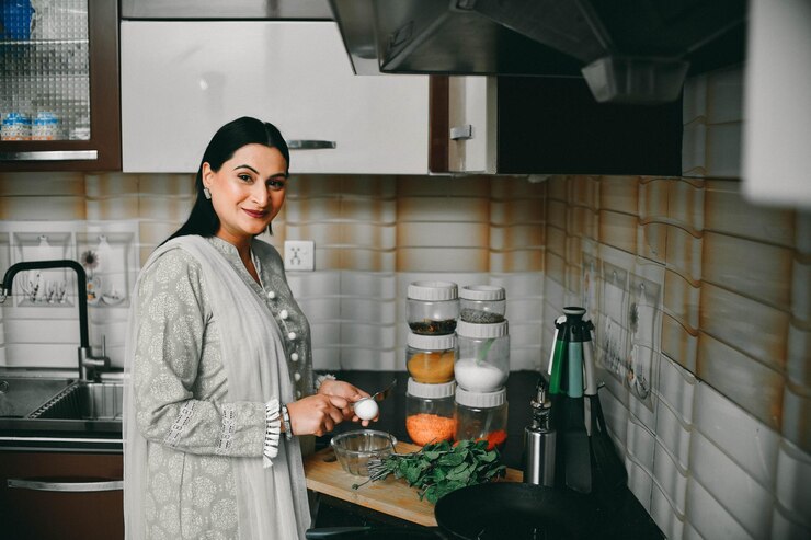 happy woman make a food in kitchen 