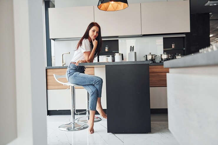 girl sit in kitchen 