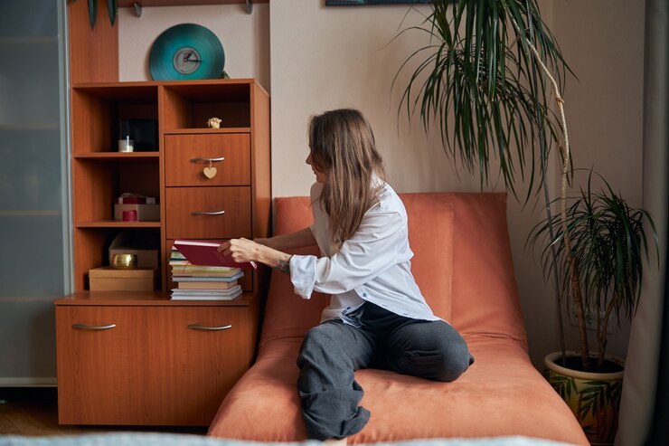 Girl sitting in a small living room 